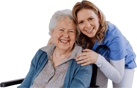 Smiling resident and caregiver posing for a photo
