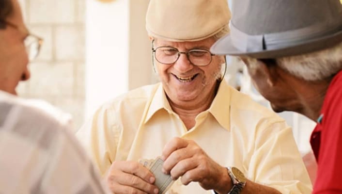 Residents enjoying a card game together