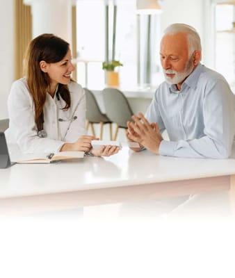A healthcare professional consulting with a senior resident