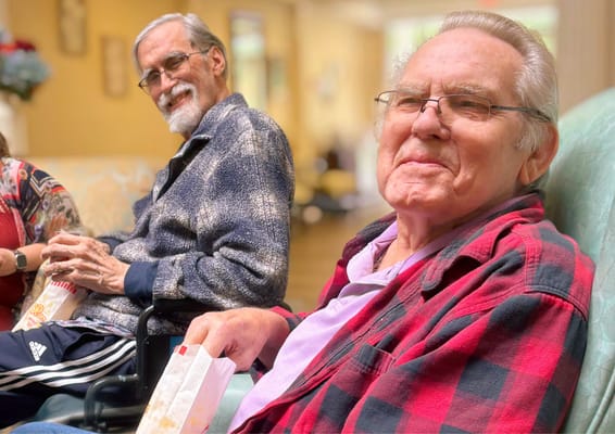 Two residents enjoying each other's company in a common area