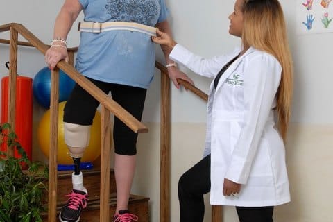 Staff assisting a resident with mobility training