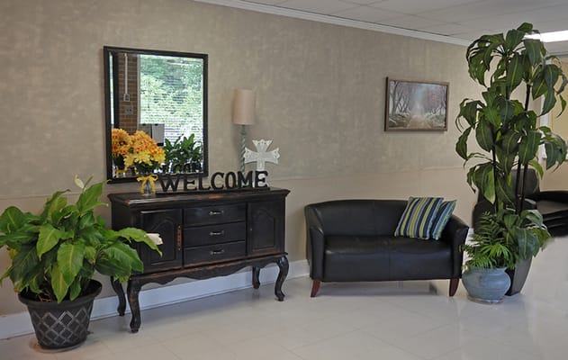 Welcoming lobby area with plants and seating