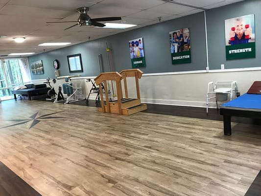 Activity room with therapy equipment and motivational posters