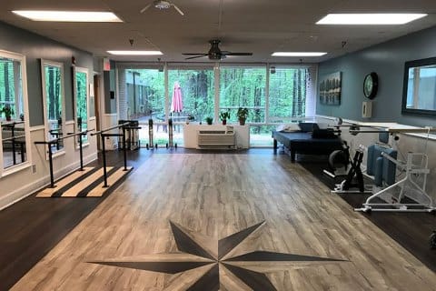 Interior view of a therapy room with exercise equipment