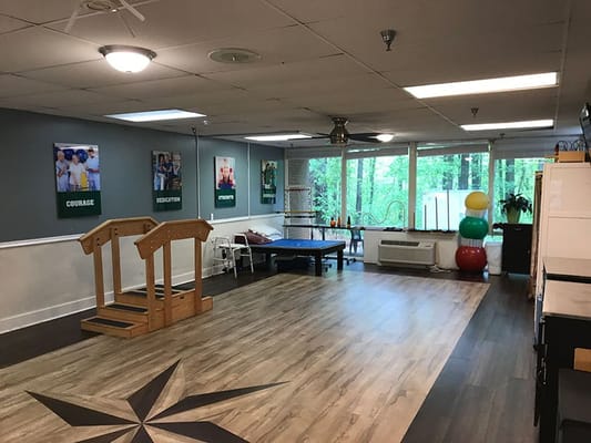 Activity room with exercise equipment and motivational posters