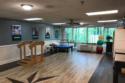 Interior view of a therapy area with equipment and natural light