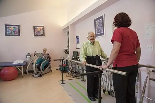 Residents participating in a therapy session with staff