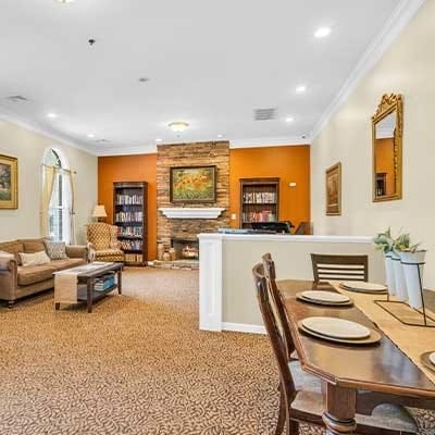 Cozy common area with bookshelves and comfortable seating