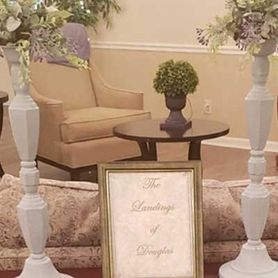 Interior view of a common area decorated with plants