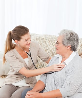 Healthcare worker checking on a senior resident
