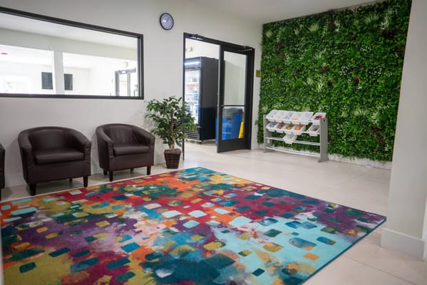 Colorful lobby area with seating and plants