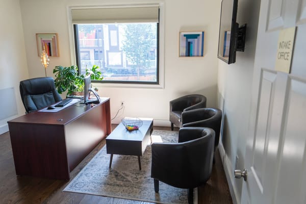 Interior view of an intake office with a desk and seating