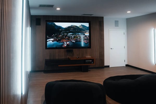 Cozy common area with comfortable seating and a large TV