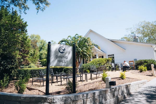 Exterior view of a dining hall with outdoor seating