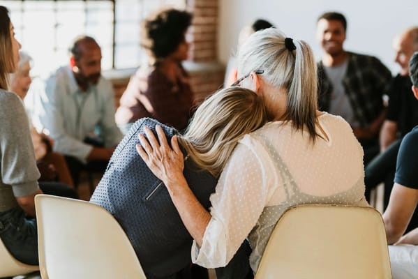 Residents in a supportive group therapy session