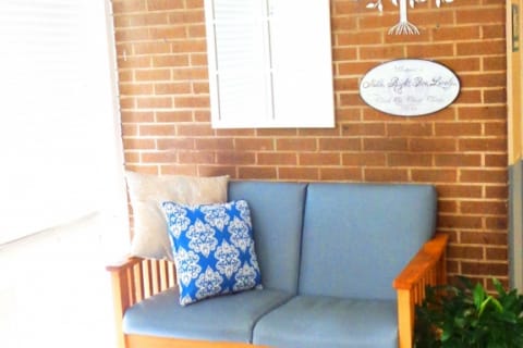 Cozy seating area with blue couch and decorative pillows