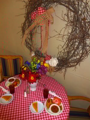 Dining table with meal plates and floral arrangement