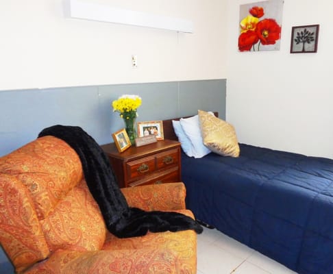 Cozy resident room with armchair and decorations