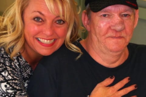 Staff member smiling with a resident