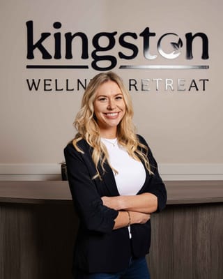 Staff member smiling at the reception area