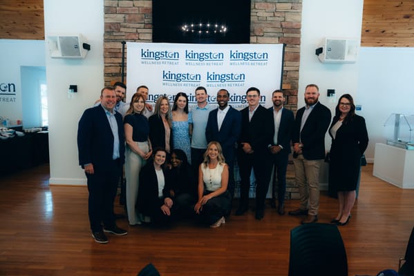 Staff and residents posing for a group photo
