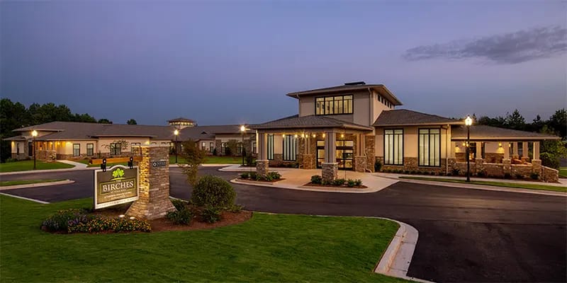 Exterior view of The Birches at Villa Rica at dusk