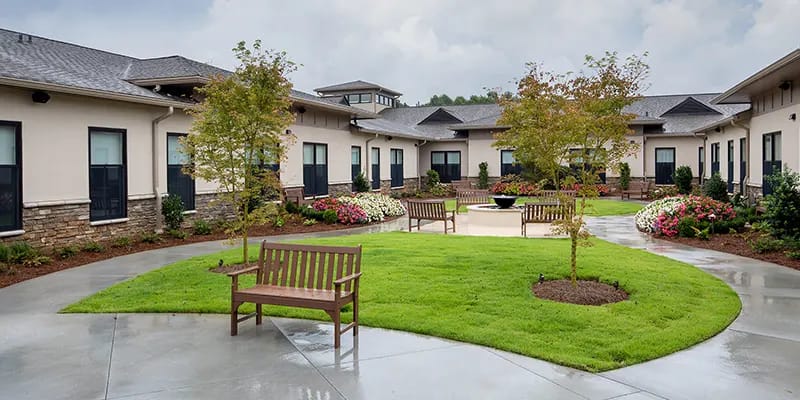 Well-maintained outdoor garden area with benches