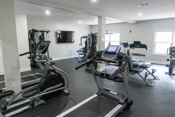 Interior view of a fitness area with exercise equipment