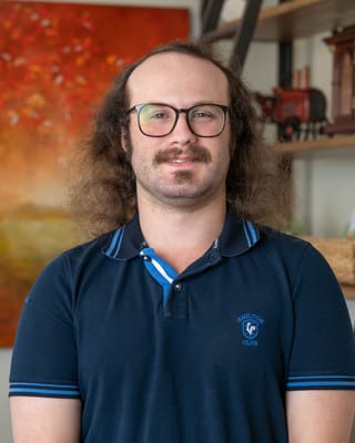 A staff member smiling in a common area