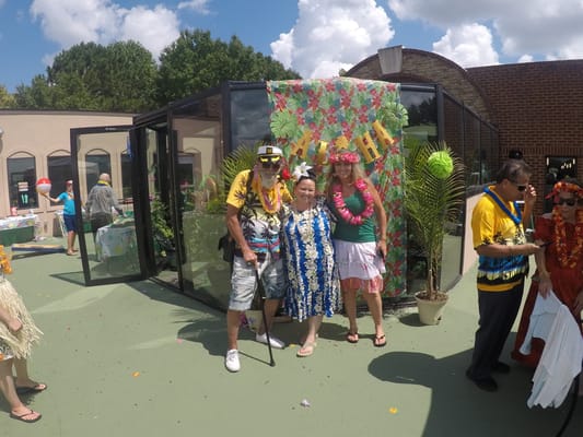 Residents and staff celebrating at an outdoor event