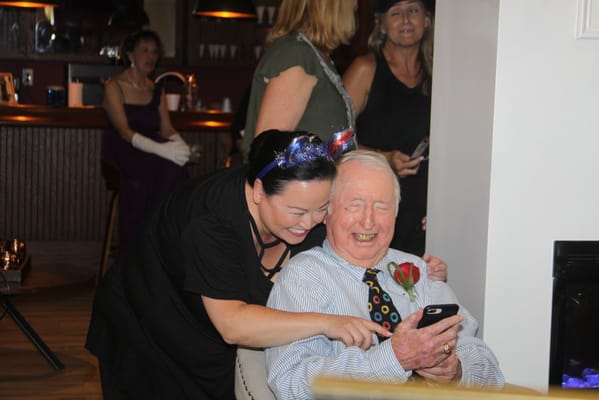 Residents enjoying a celebratory event in a common area