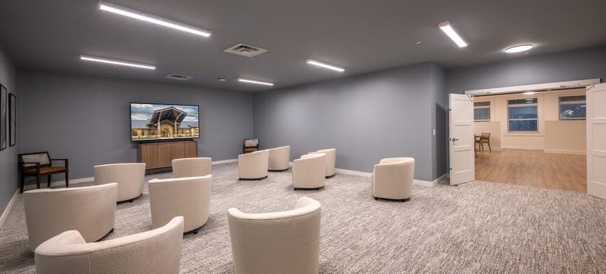 Interior common area with seating and TV