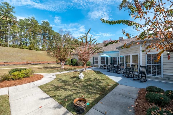 Outdoor area with seating and landscaped garden