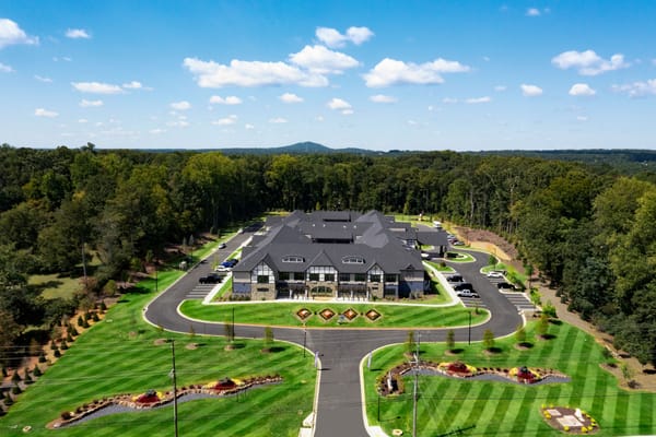 Aerial view of a senior living facility surrounded by nature