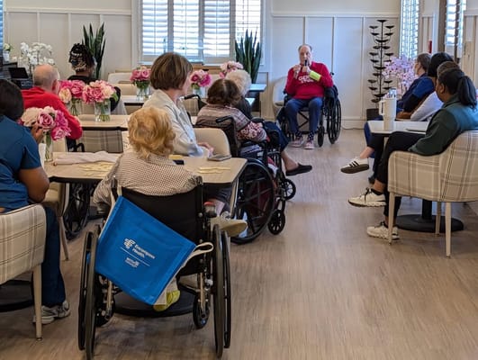Residents and staff participating in an activity in a common area