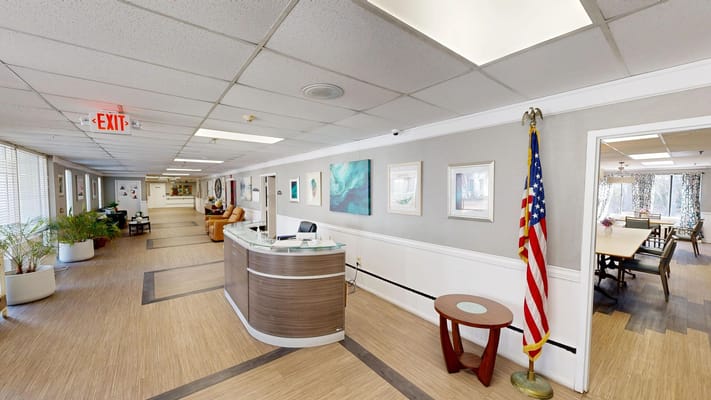 Interior view of a well-lit common area with reception