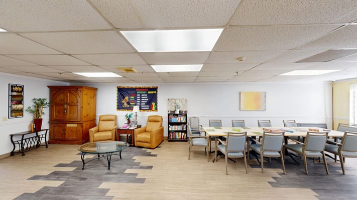 Common area with chairs and tables for activities