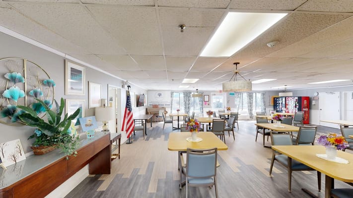 A spacious common area with tables and decorations