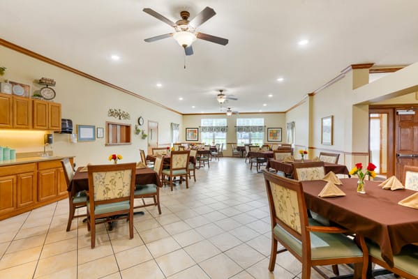 Well-arranged dining room with tables set for a meal