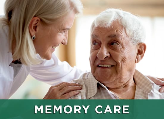 Caregiver interacting with a senior man in a bright room