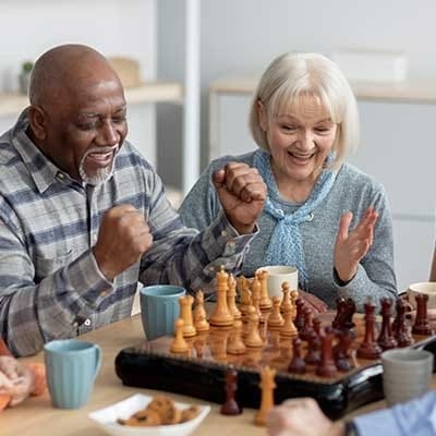 Residents enjoying a chess game with excitement