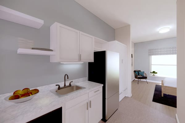 Interior view of a senior living room with kitchenette