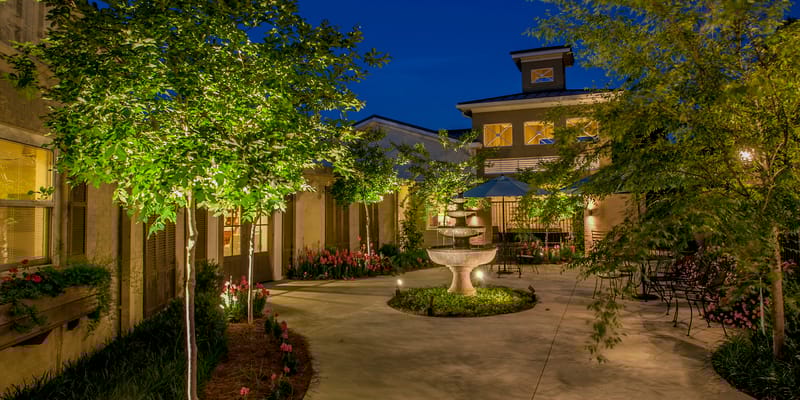 A serene outdoor garden area with a fountain