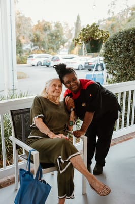 Resident and staff member enjoying time together outside