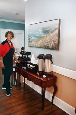 Staff member in a welcoming common area