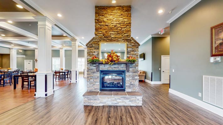 Interior view of a cozy common area with a fireplace