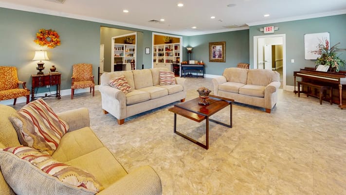Common area with comfortable seating and piano