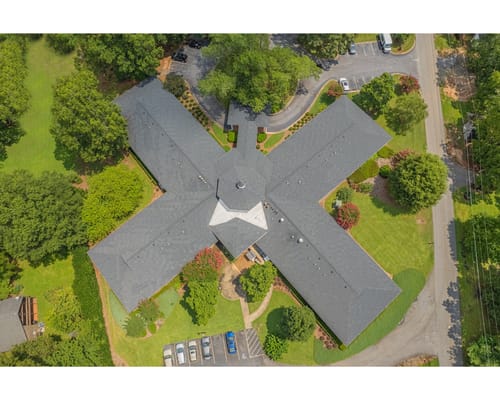 Aerial view of the facility with landscaped grounds