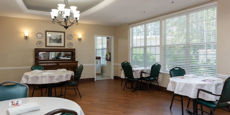 Bright dining room with tables and chairs