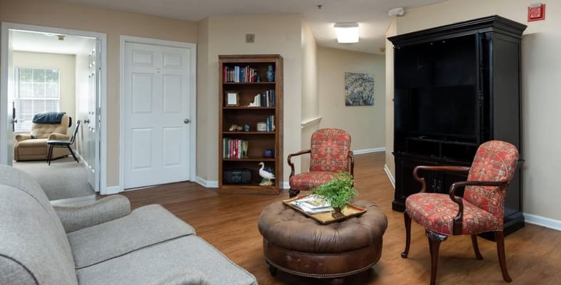 Cozy living room area with seating and bookshelves